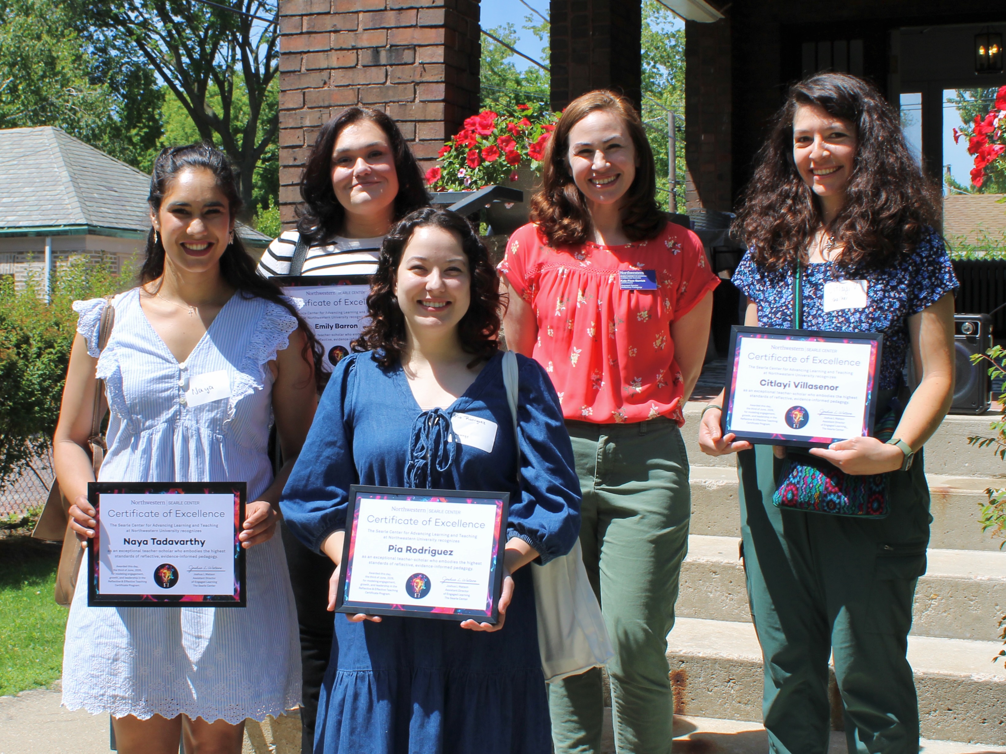 Photo of the awardees holding their completed certificates