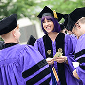 students at graduation in caps and gowns